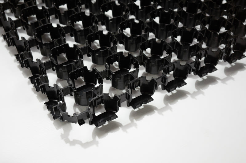 Load image into Gallery viewer, Close up of black Terram Bodpave 40 permeable paving grid on a white background