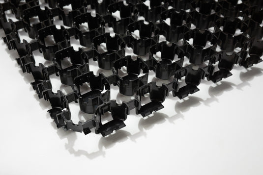 Close up of black Terram Bodpave 40 on a white background