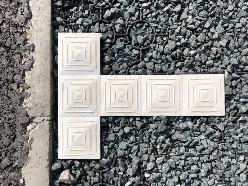 Load image into Gallery viewer, Close up of white Bodpave 85 markers used to demarcate car park bay