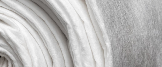 Roll of white, non-woven geotextile