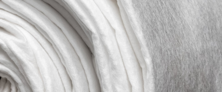 Roll of white, non-woven geotextile