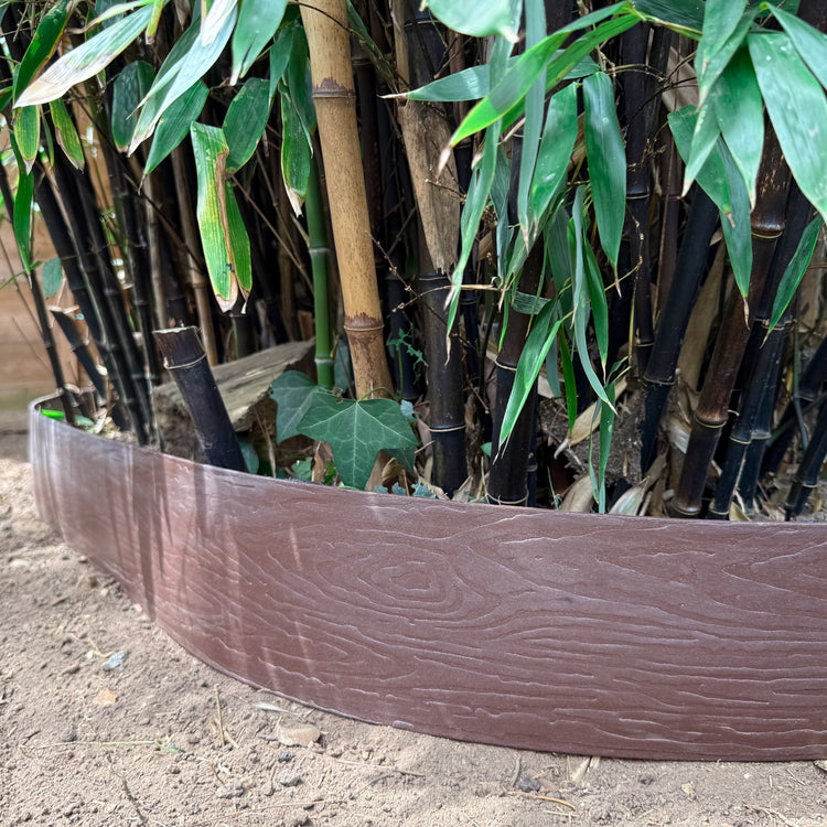 Lawn edging combined with root barrier to contain bamboo